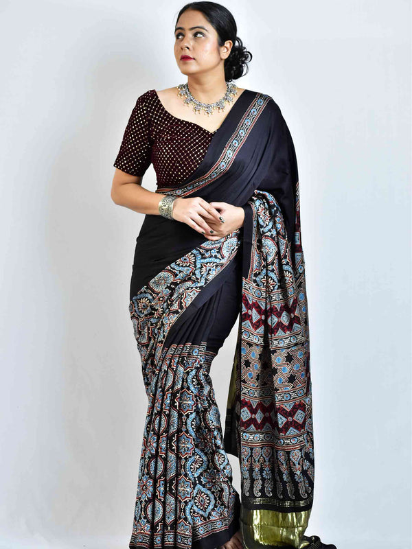 Avril  - Ajrakh hand block printed Modal Silk Saree with zari pallu