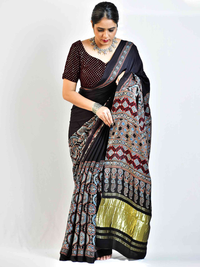 Avril  - Ajrakh hand block printed Modal Silk Saree with zari pallu