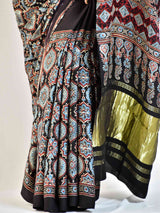 Avril  - Ajrakh hand block printed Modal Silk Saree with zari pallu