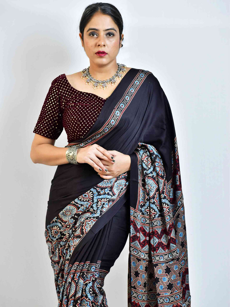 Avril  - Ajrakh hand block printed Modal Silk Saree with zari pallu